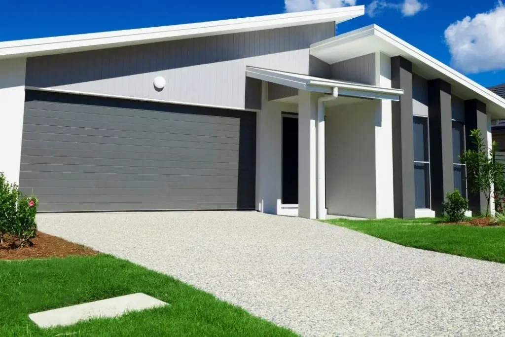 modern house with an exposed aggregate driveway